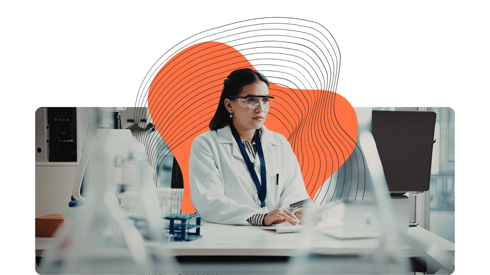 Lab Tech Looking Up Information on Computer_AI Chatbot Webpage